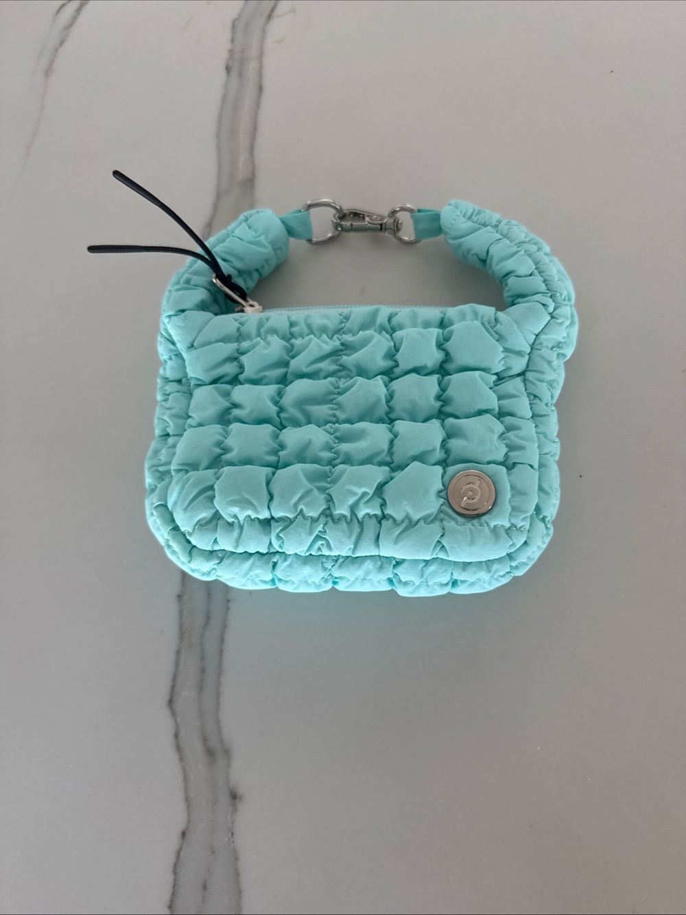 Peleton Quilted Bag Charm. Soft Blue. Zipper Closure. Key Chain